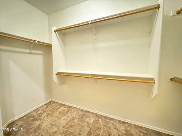 a view of a big room with windows