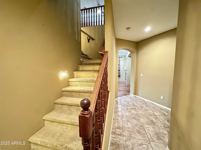 a bathroom with a double vanity sink and mirror