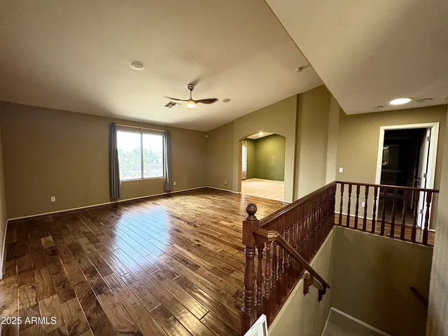 a view of a yard with a house in the background