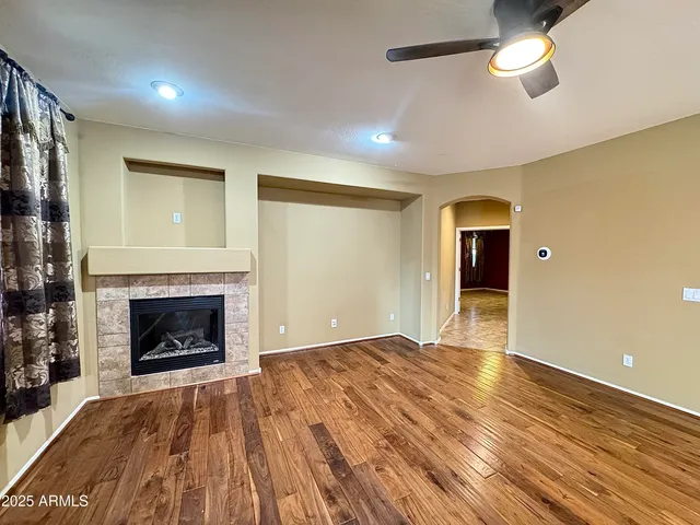 a view of hallway with furniture and a window