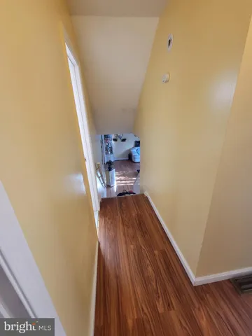 a view of entryway with wooden floor