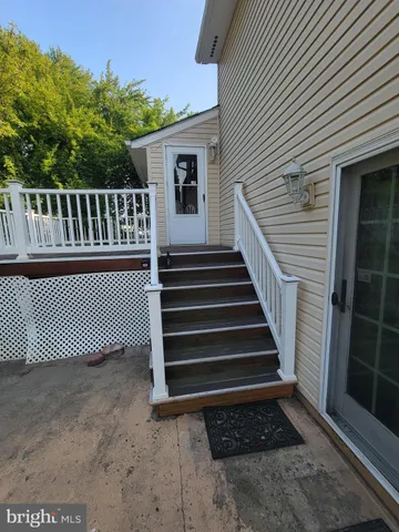 a view of a house with wooden fence