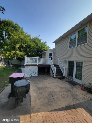 a view of a chairs and table in backyard of the house