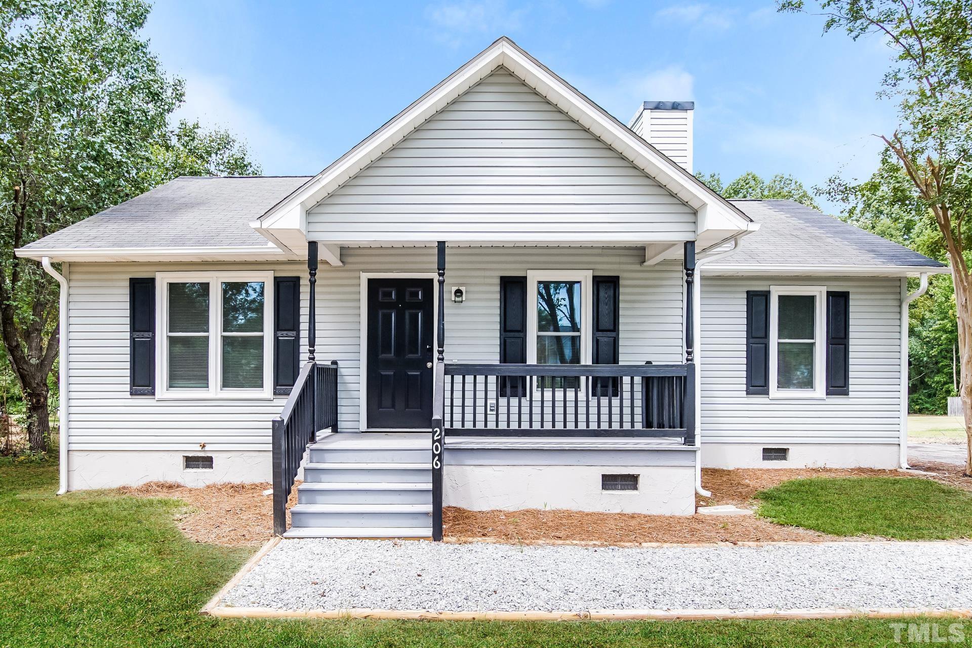 206 Scotts Creek Run Angier, NC 27501 - Photo 1 of 16 a front view of a house with a yard