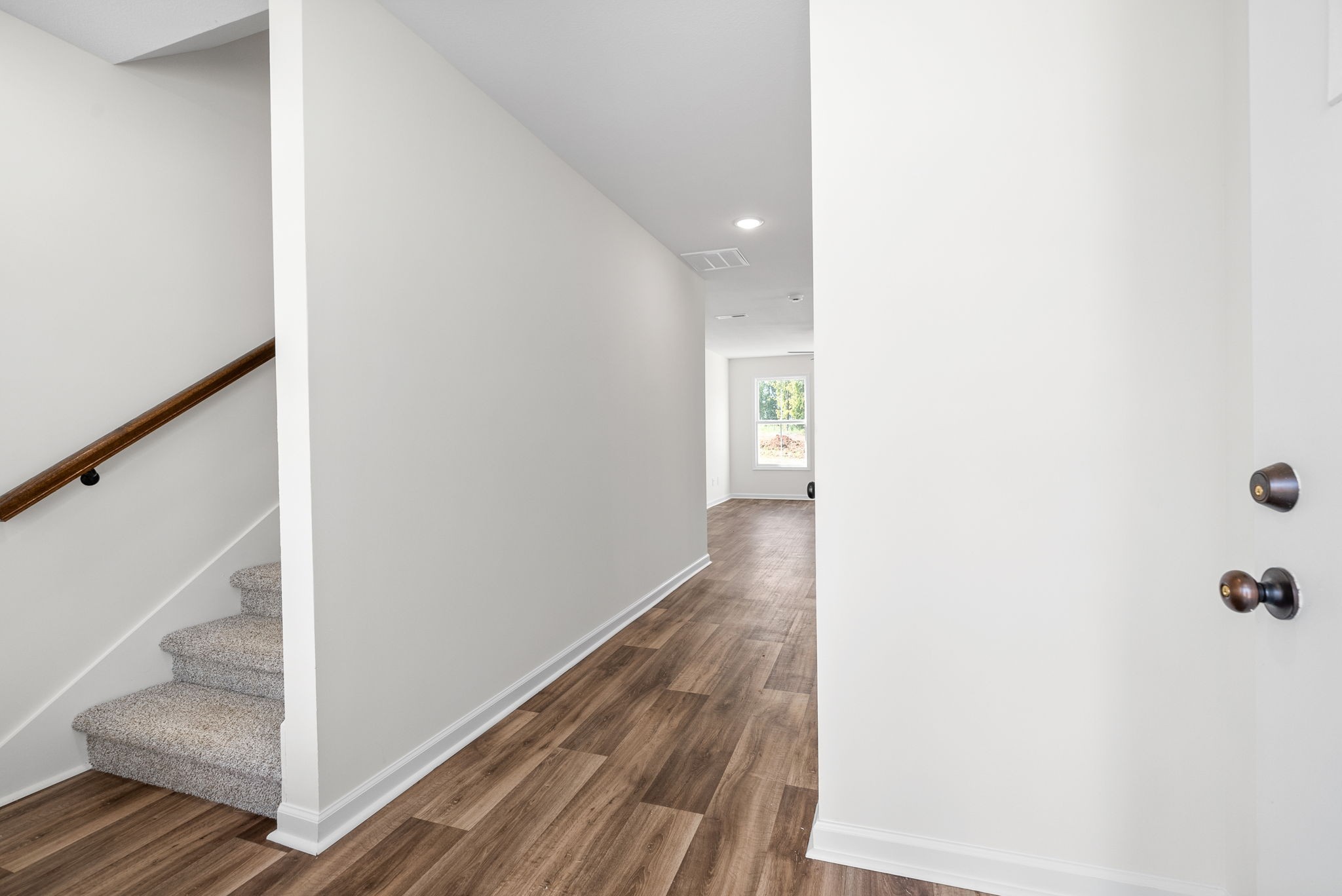 148 Quarry Rdg Road Clarksville, TN 37043 - Photo 5 of 37 a view of a hallway with wooden floor and entryway