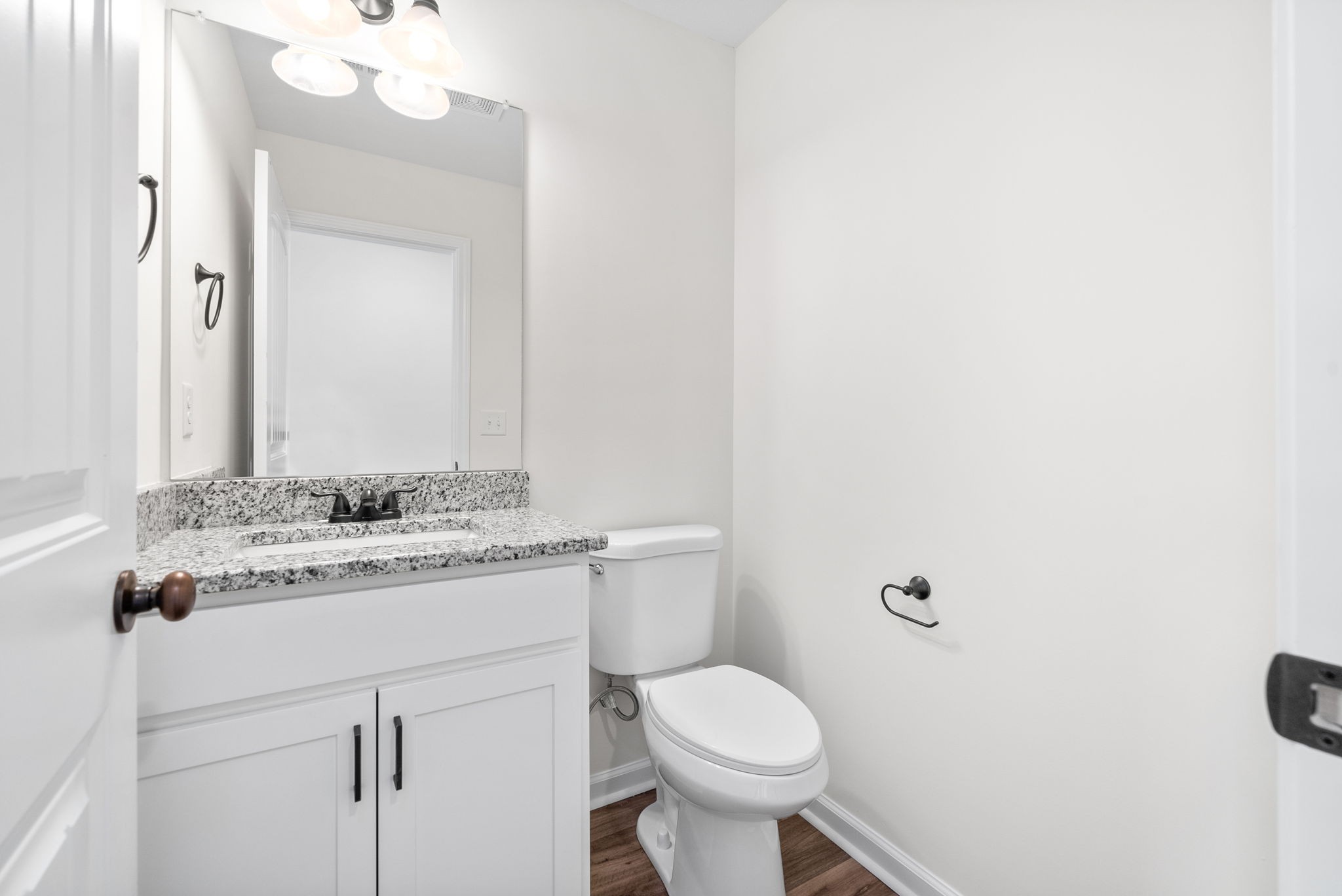 148 Quarry Rdg Road Clarksville, TN 37043 - Photo 6 of 37 a bathroom with a granite countertop sink a toilet and a mirror