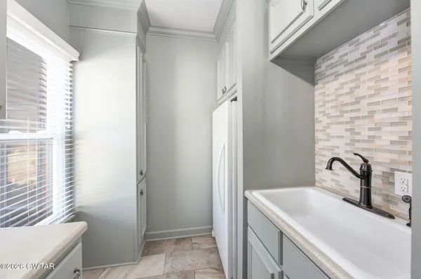 a bathroom with a sink mirror and toilet
