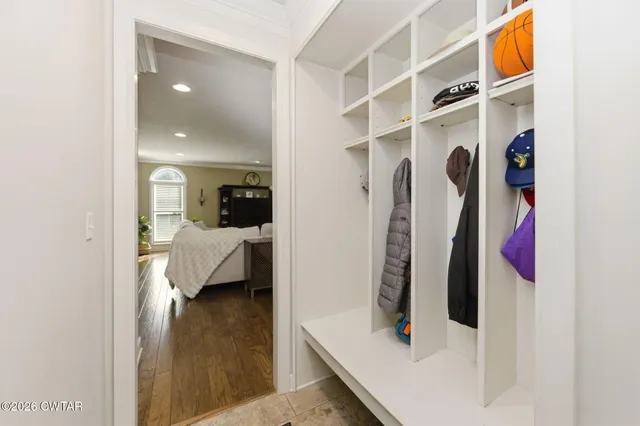 a spacious bedroom with a bed and a fireplace