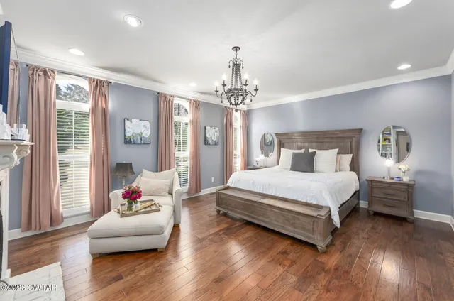a bathroom with a sink mirror and shower