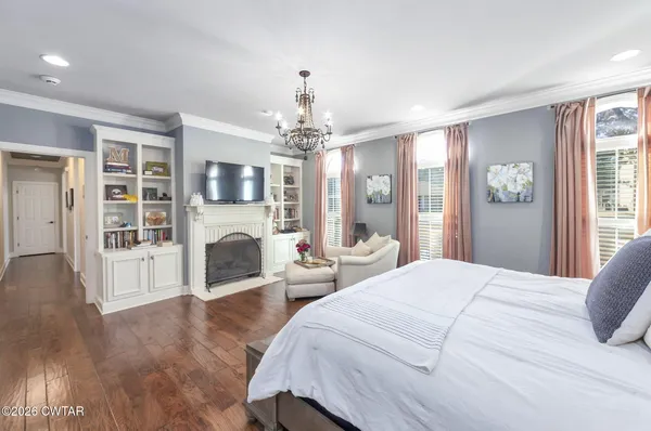 a bathroom with a sink mirror and shower