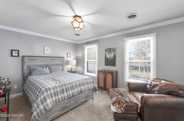 a view of a table and chairs in patio of the house