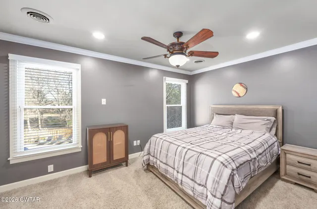 a view of a patio with table and chairs and potted plants