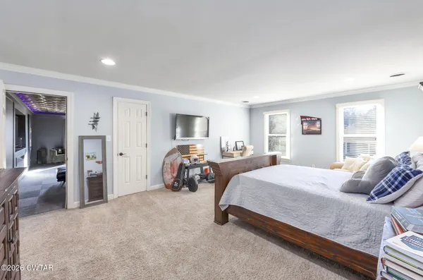 a view of a patio with table and chairs and potted plants