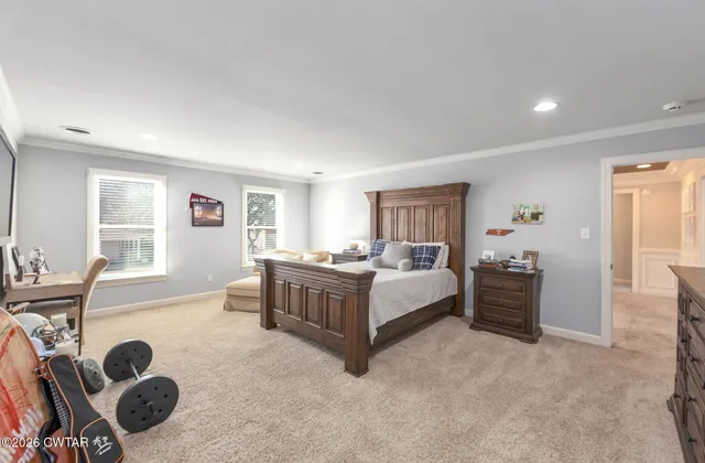 a view of a patio with table and chairs and potted plants