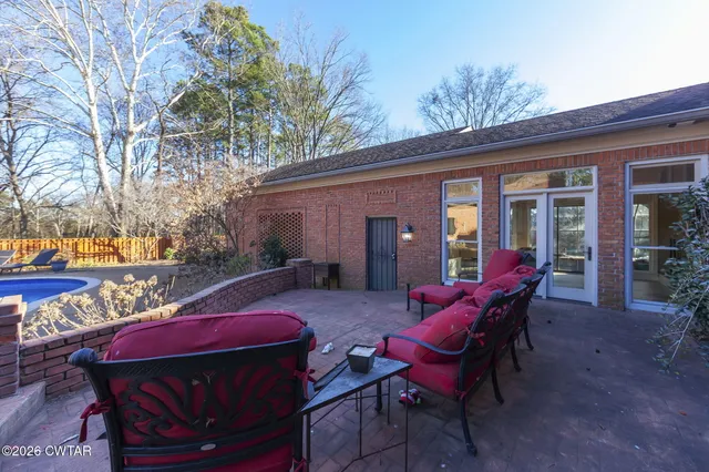 an aerial view of a houses with a yard