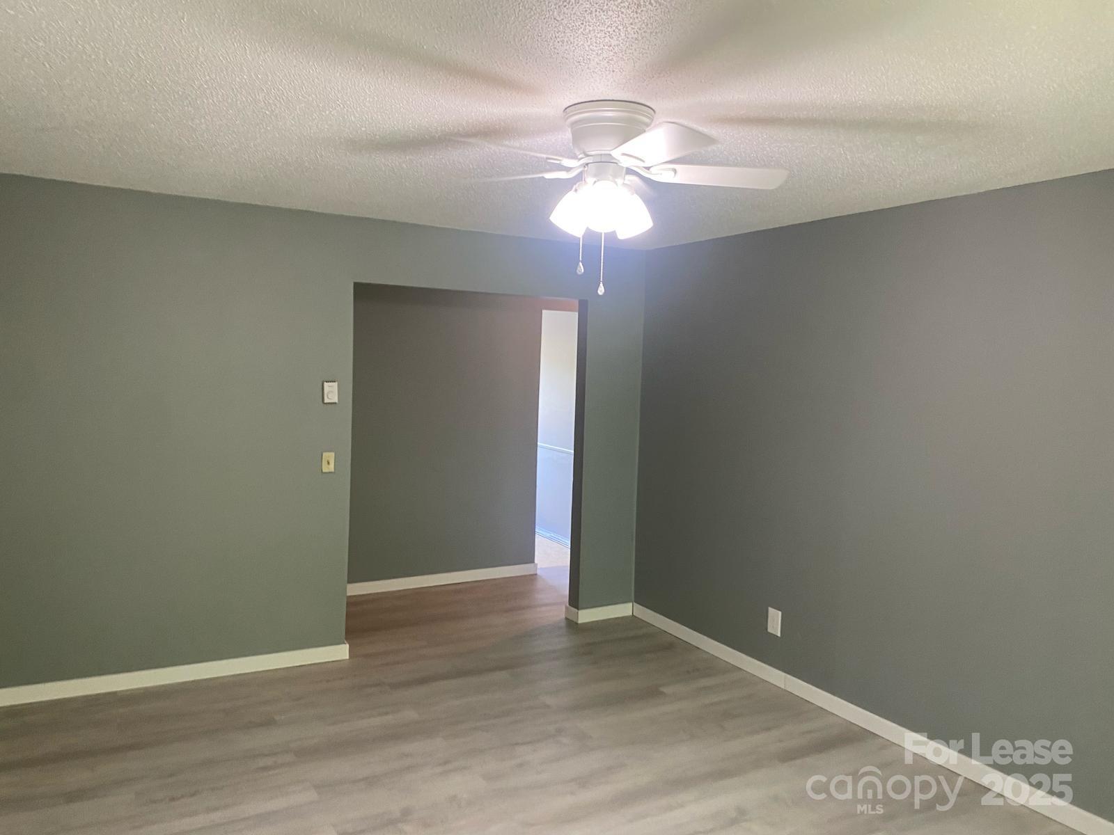 1966 Lakeview Road, Unit 12 Asheboro, NC 27203 - Photo 13 of 14 a view of an empty room with wooden floor