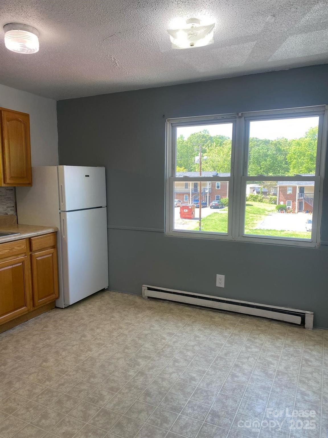 1966 Lakeview Road, Unit 12 Asheboro, NC 27203 - Photo 6 of 14 a kitchen with refrigerator and window