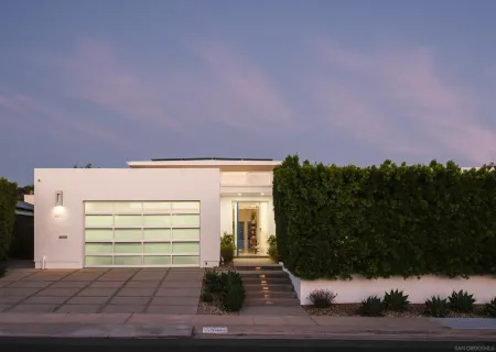a front view of a house with yard