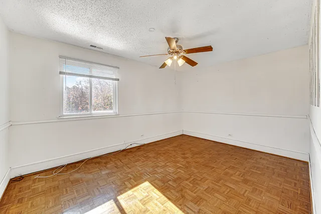 a view of a big room with wooden floor and closet