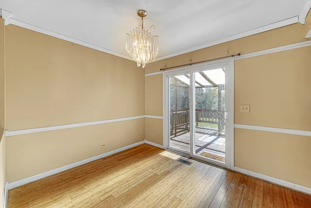 a view of a room with wooden floor and balcony