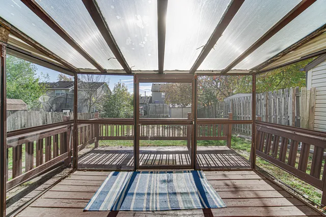 a view of a balcony with wooden floor