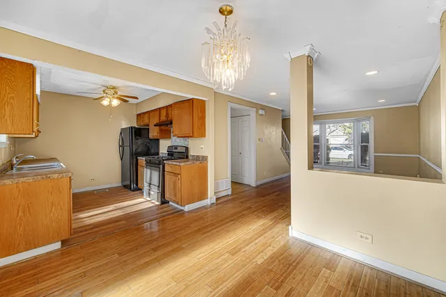 a kitchen with stainless steel appliances a refrigerator and microwave
