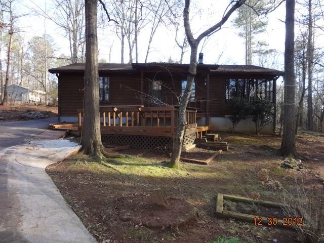 9465 Cole Road Villa Rica, GA 30180 - Photo 1 of 1 a view of a house with backyard porch and sitting area