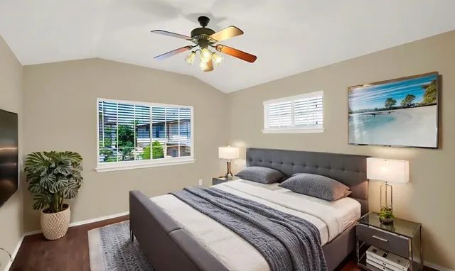 a bedroom with a large bed and a window