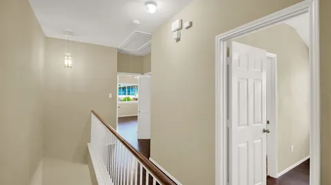 a view of a hallway with an entryway