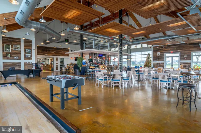 a view of a swimming pool with outdoor seating