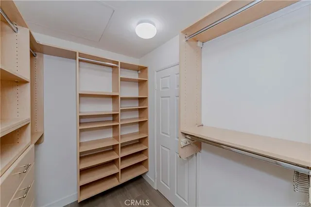 a view of closet area with empty racks