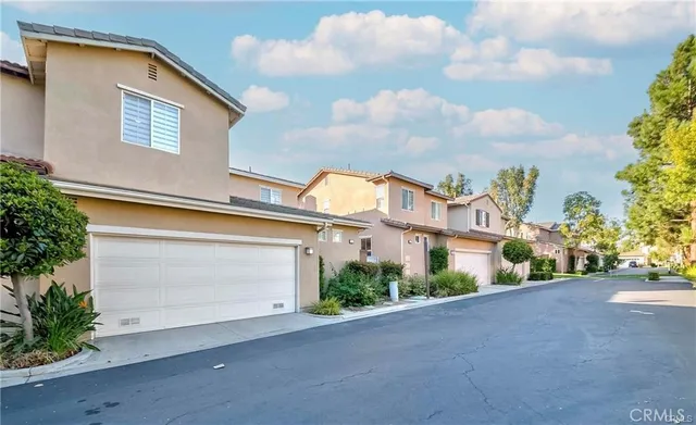 a view of a house with a street