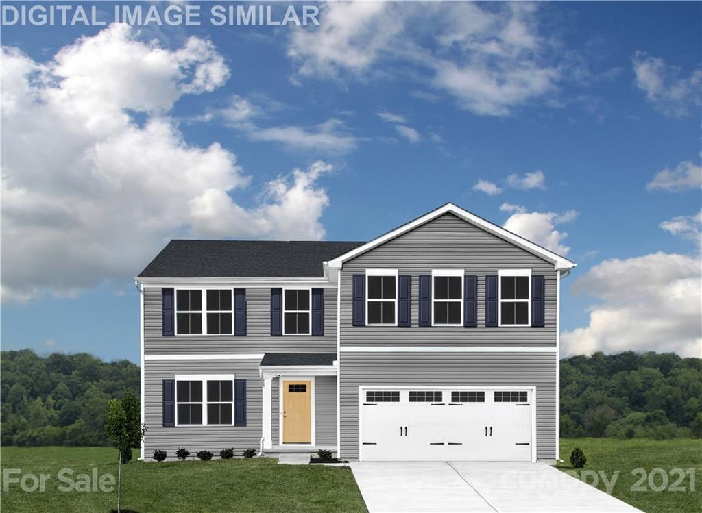 5130 Tinker Field Road, Unit 2021 Charlotte, NC 28215 - Photo 1 of 10 a big house with a big yard and more windows