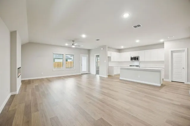 a view of kitchen with wooden floor