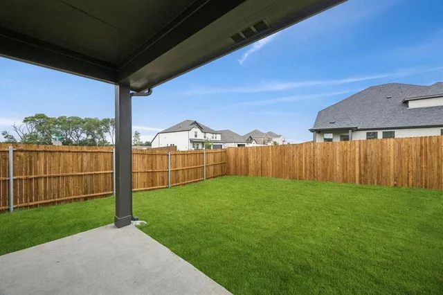 a view of a backyard with potted plants