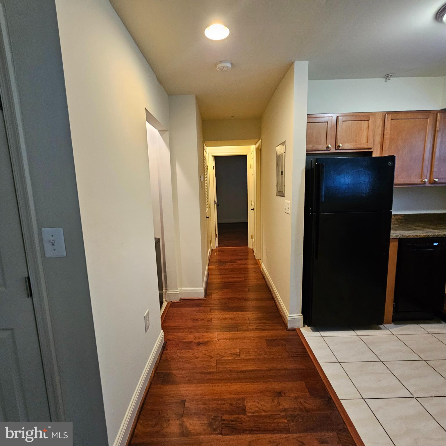 4800 C Street Southeast, Unit 102 Washington, DC 20019 - Photo 10 of 14 a hallway with wooden floor and staircase