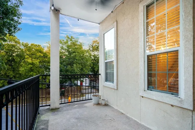 a view of a balcony with an outdoor space