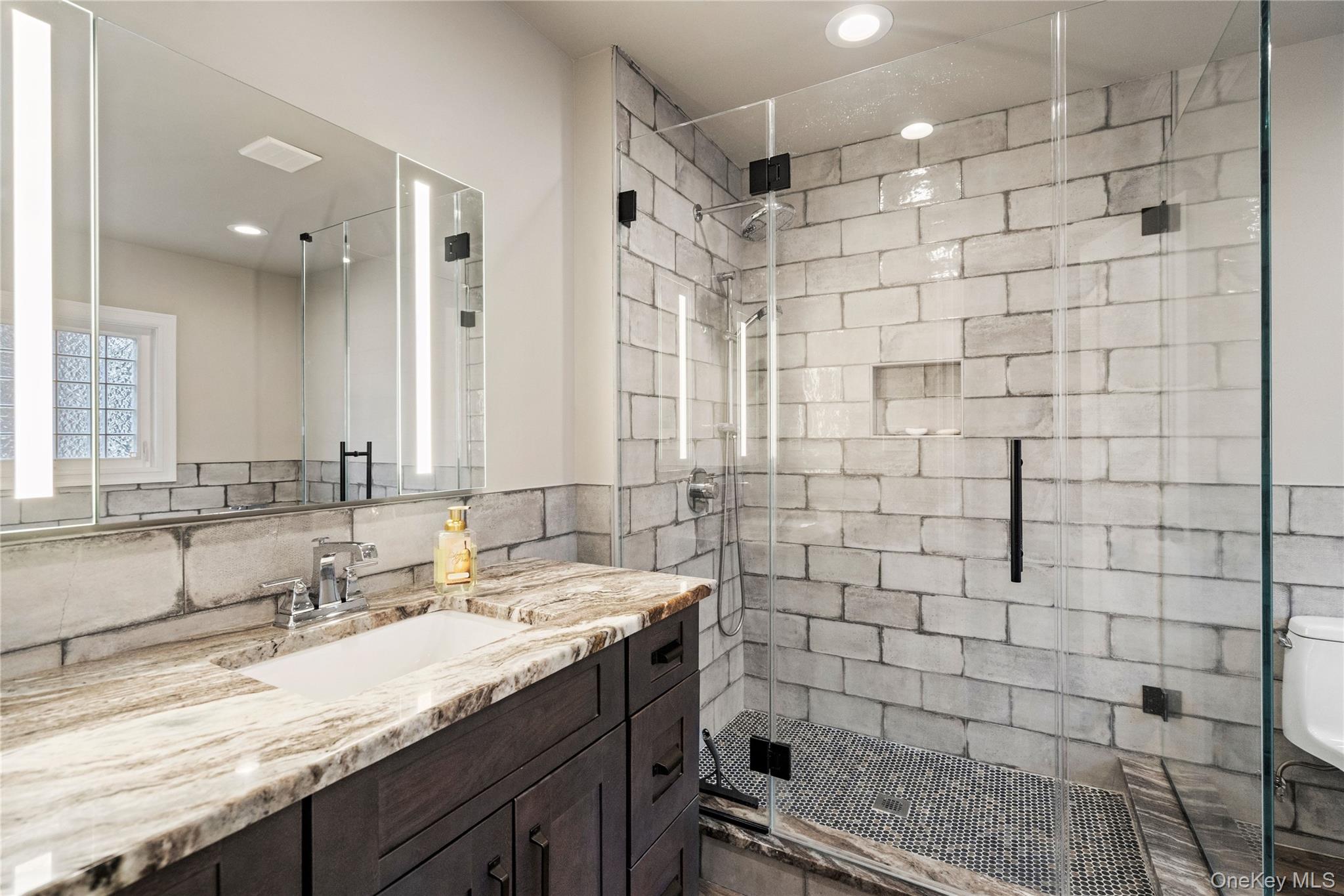 58 Timber Ridge Drive Commack, NY 11725 - Photo 20 of 34 Bathroom with a stall shower, vanity, recessed lighting, and decorative backsplash