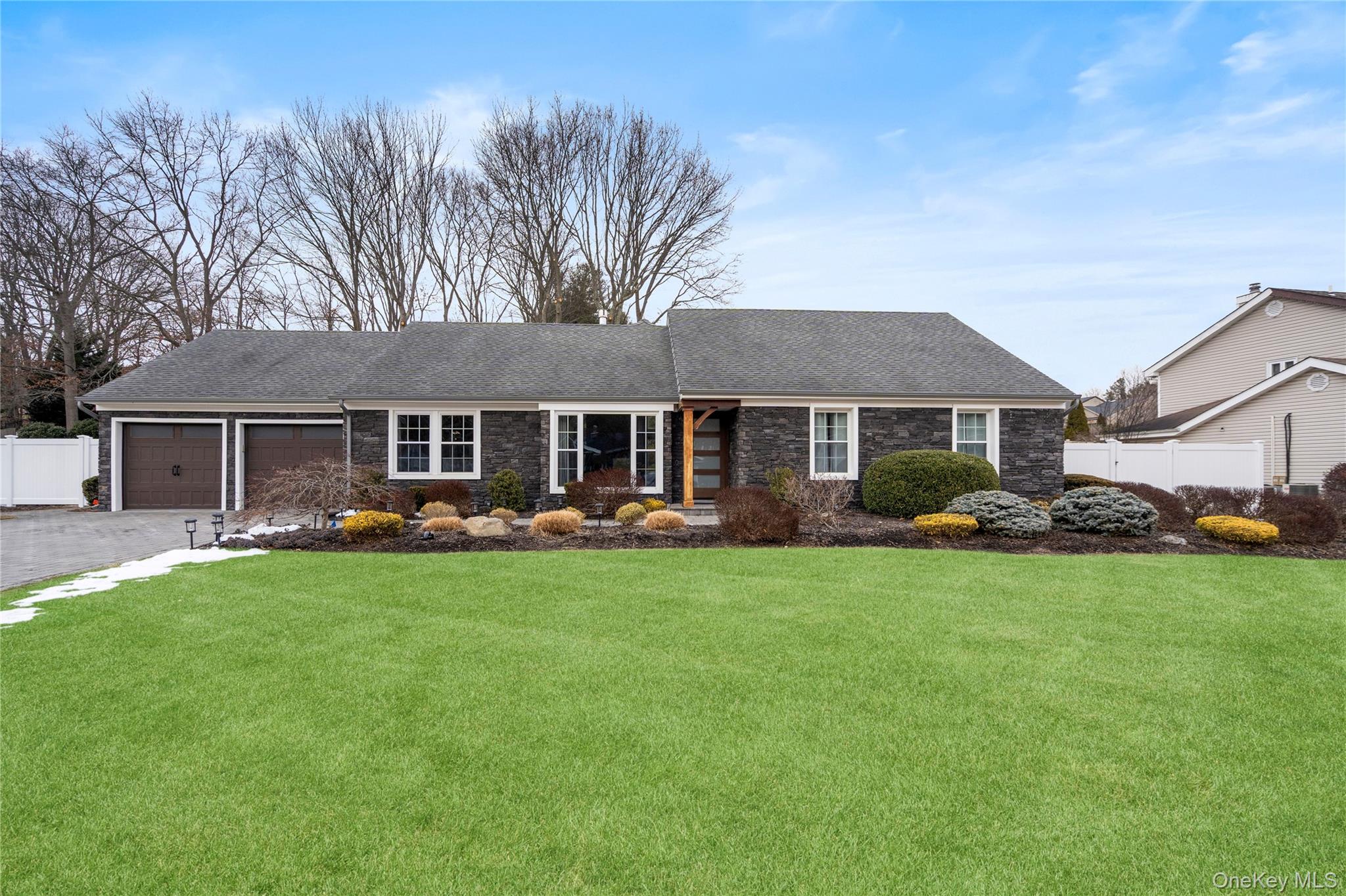 58 Timber Ridge Drive Commack, NY 11725 - Photo 3 of 34 Single story home featuring asphalt driveway, a shingled roof, a garage, and stone siding