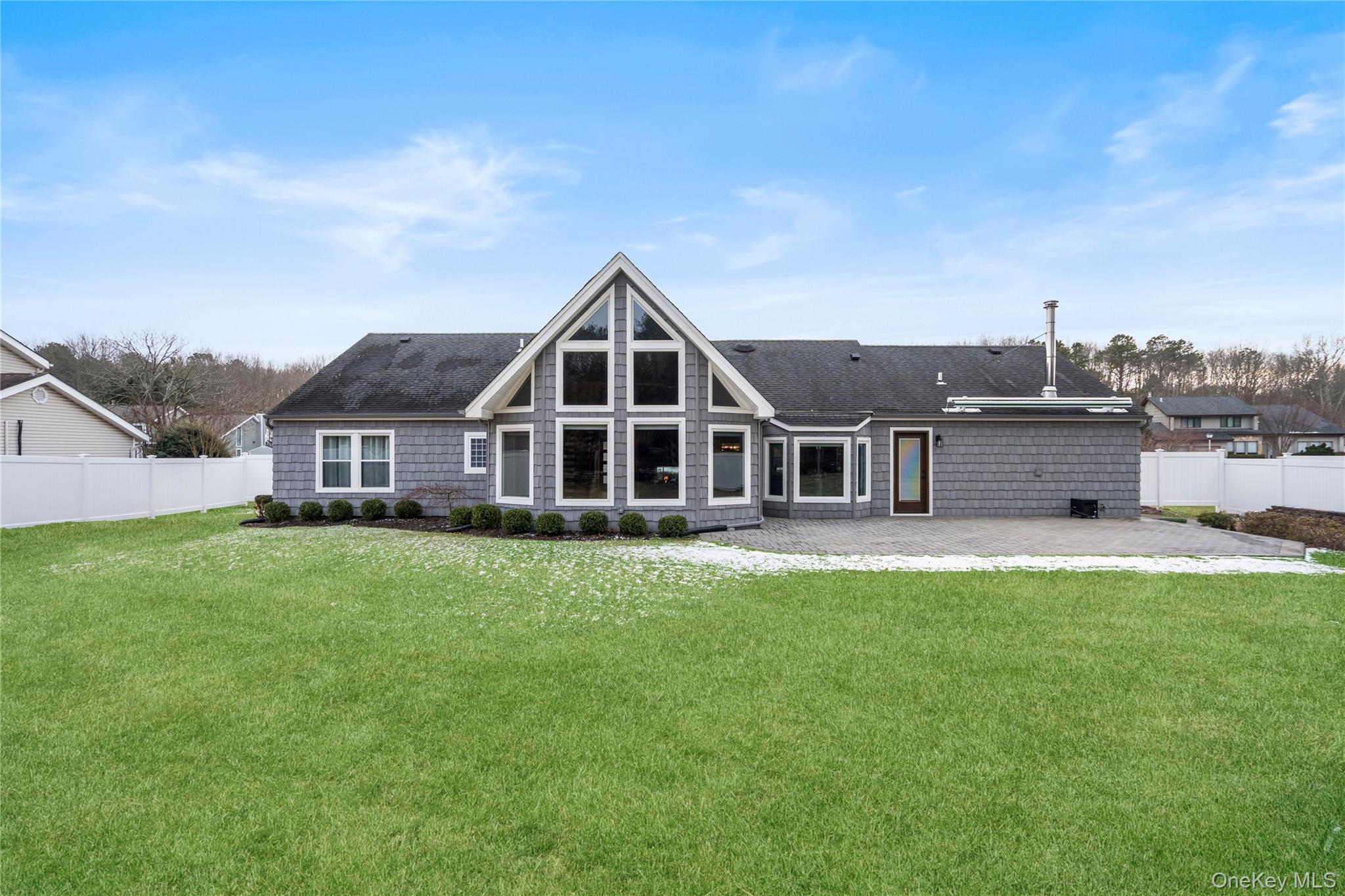 58 Timber Ridge Drive Commack, NY 11725 - Photo 31 of 34 Rear view of property featuring a fenced backyard, a patio area, and roof with shingles