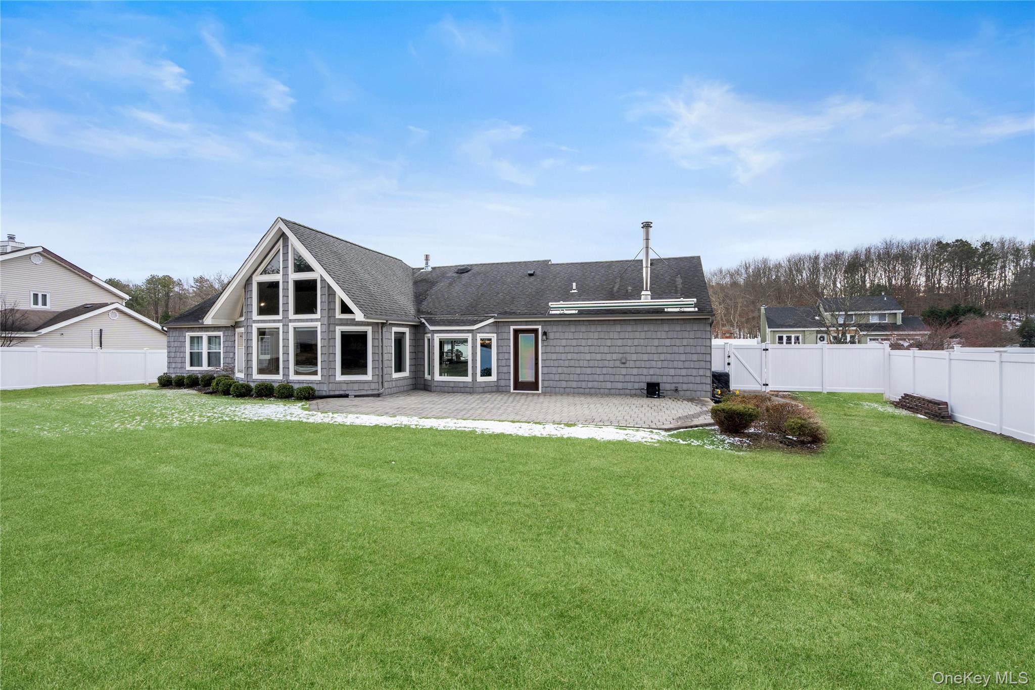 58 Timber Ridge Drive Commack, NY 11725 - Photo 34 of 34 Rear view of house with a fenced backyard, a patio area, a gate, and roof with shingles