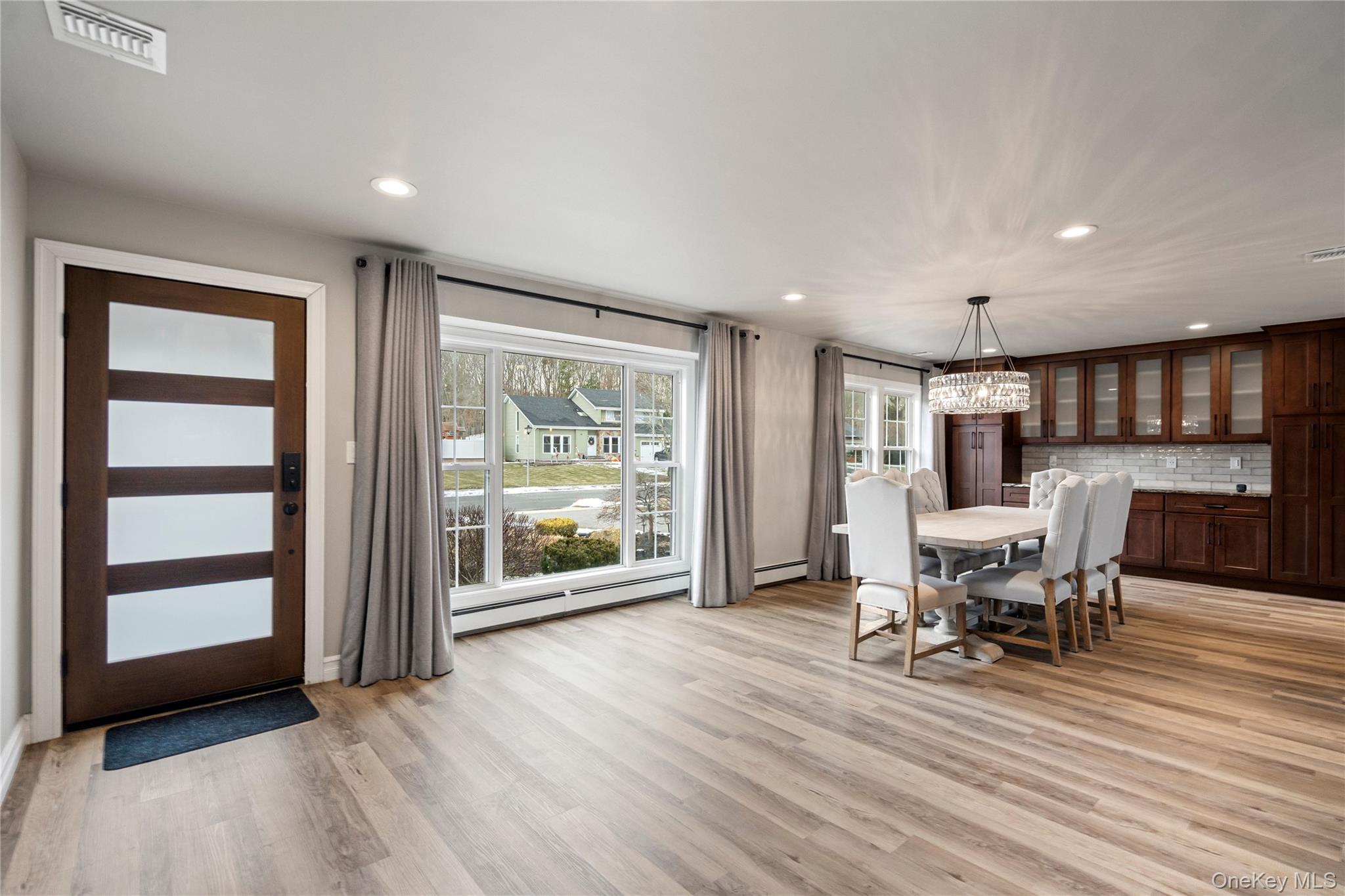 58 Timber Ridge Drive Commack, NY 11725 - Photo 4 of 34 Dining space featuring recessed lighting, light wood-style flooring, and a baseboard heating unit