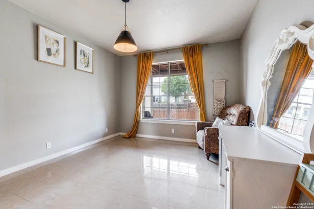 a view of a livingroom with wooden floor and a window