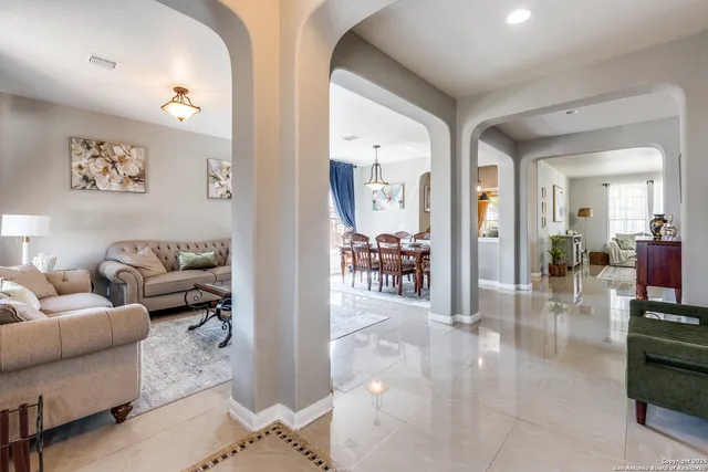 a living room with furniture and a table