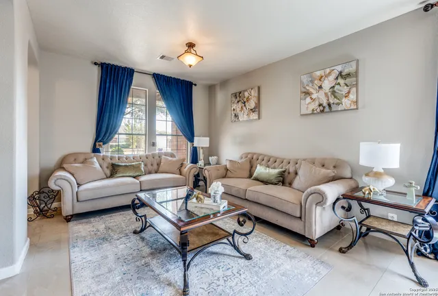 a living room with furniture and a window