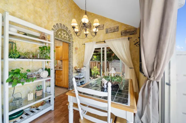 a view of an entryway with wooden floor and windows