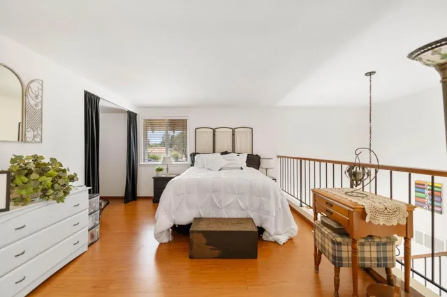 a bed room with a bed and a window