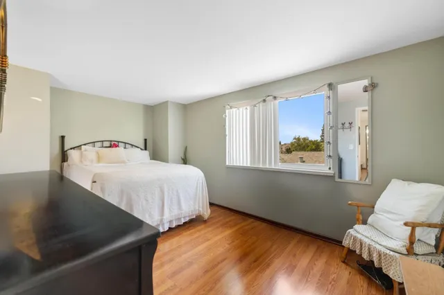 a bedroom with bed and window