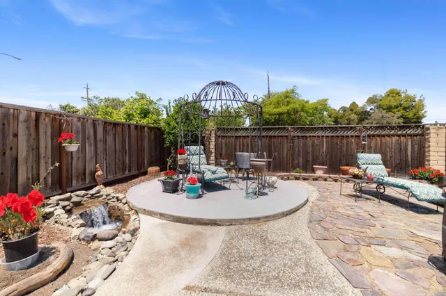 a view of a swimming pool with a patio