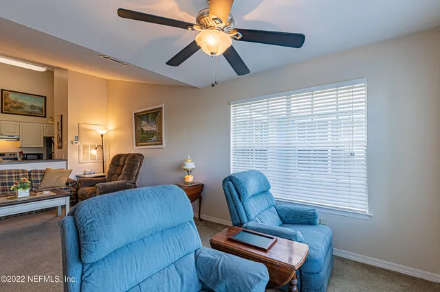 a work room with furniture and a window